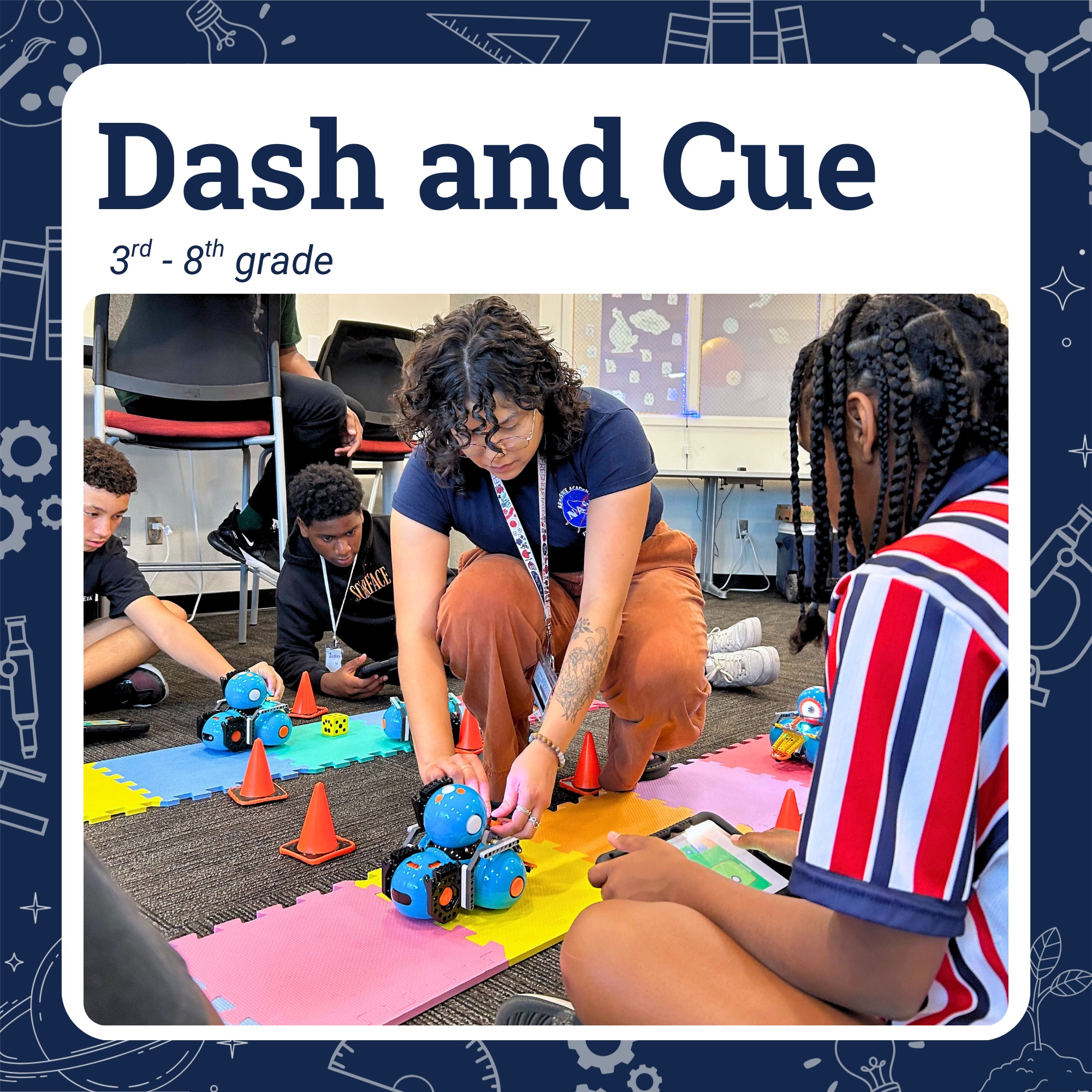 Tutor kneeling to help students with a Dash robot and its accessories