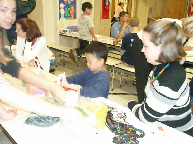 Slide showing recruitment poster and students working together