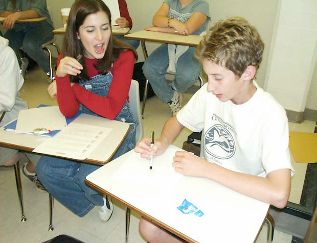 Slide showing recruitment poster and students working together