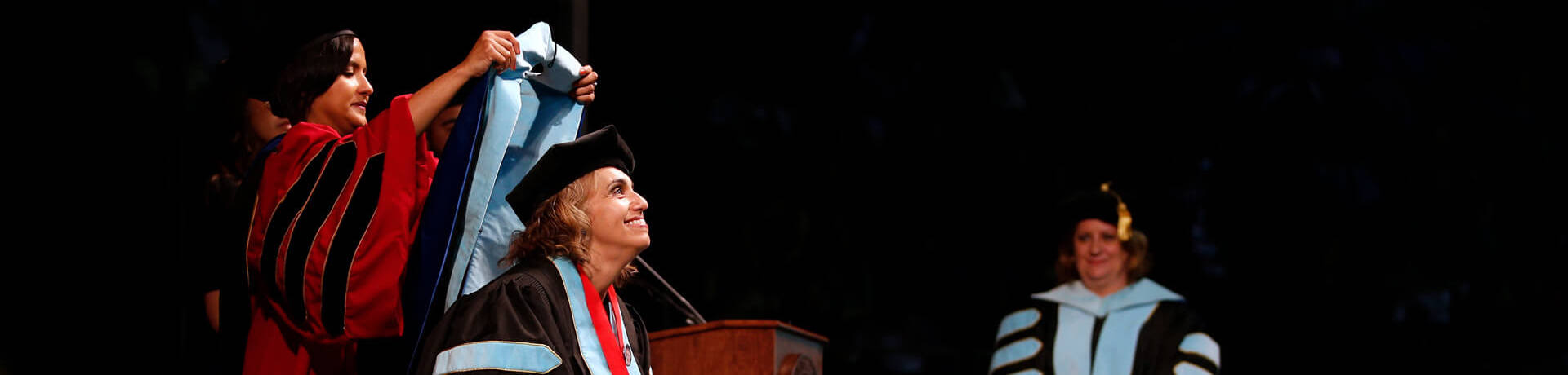 Ed.D. candidate being hooded at commencement