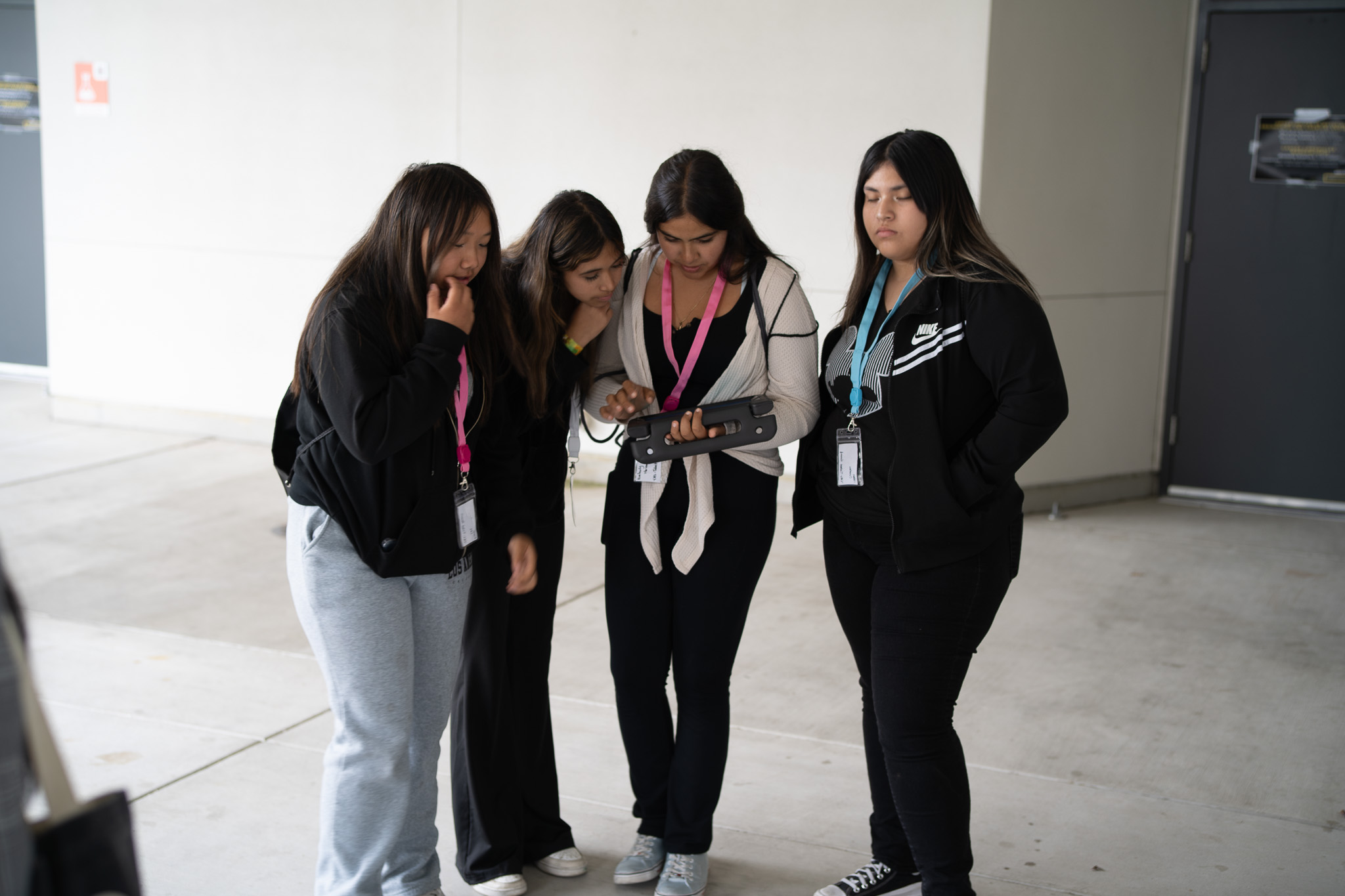 4 girls coding on an ipad